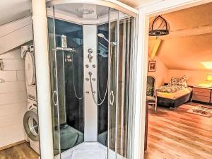 a walk in shower in a room with at Apartment Apt- Luna by Interhome in Feldkirchen in Kärnten +17 photos