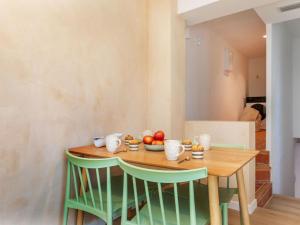 a table with a bowl of fruit on it at Apartment Edificio Candela-2 by Interhome in L'Ametlla de Mar