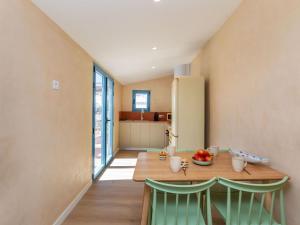 a kitchen and dining room with a table and chairs at Apartment Edificio Candela-2 by Interhome in L'Ametlla de Mar +16 photos