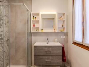 a bathroom with a sink and a shower at Holiday Home Mimi by Interhome in Verceia