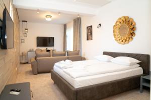 a bedroom with a bed and a living room at Annador in Jupiter
