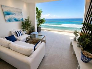 a living room with a view of the ocean at Maison Bella View in Moulay Bousselham