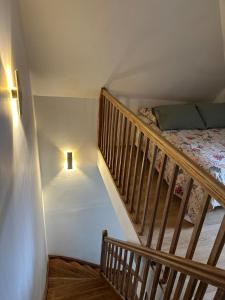 a bedroom with a staircase with a bed and a light at Hyper centre ville de Reims avec parking in Reims