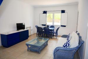 a living room with a couch and a table at Hotel Marazul in Mojácar +15 photos