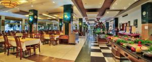 a restaurant with tables and chairs and a cafeteria at Hedef Resort Hotel in Konaklı