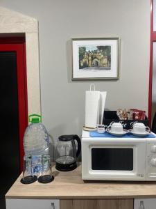 a microwave sitting on top of a kitchen counter at Апартамент за гости КРИСИ - Apartment for rent KRISI in Vidin