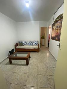 a living room with a couch and a coffee table at Riacho Fundo 1 - Riacho Mall in Brasília
