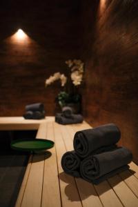 a room with a pile of towels on a wooden floor at Hotel Åregården in Åre