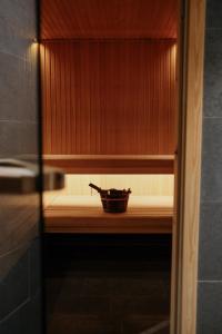 a wooden cabinet with a bowl on a shelf at Hotel Åregården in Åre +53 photos
