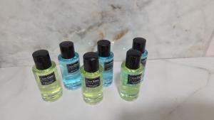 a group of four liquids sitting on a counter at אחוזת מונפלייר in Tiberias