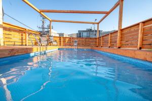 a swimming pool on the deck of a cruise ship at אחוזת מונפלייר in Tiberias