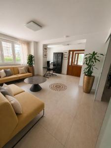 a living room with a couch and a table at Willa Celina in Karpacz