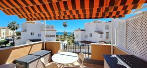 a balcony with a table and chairs and a view at A & G Casares Costa in San Luis de Sabinillas