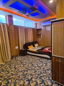 a bedroom with a bed in a room at Hotel Dilli Darbar and Restaurant in Bandipura