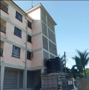 a building with a lot of windows on it at Zariah Homes 2BR in Kakamega