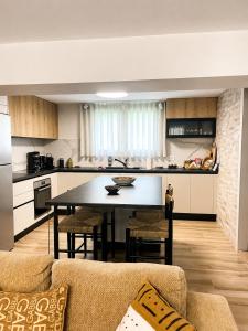 a kitchen with a table and chairs in a room at Poly's Villa Lefkada in Lefkada +83 photos
