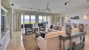 a living room with a couch and a table at 311 Mariners Club in Key Largo