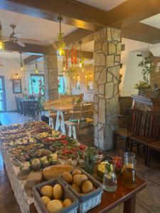 a buffet of food on a table in a restaurant at Bieszczadzki Dworek Polanczyk in Polańczyk