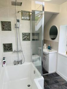 a bathroom with a shower and a sink at Scarisbrick Apartment Sleeps 6 in Scarisbrick +35 photos