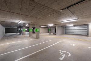an empty parking lot in a parking garage at Muhu Apartments in Velké Hamry