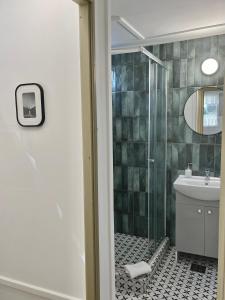 a bathroom with a shower and a sink at Harmónia faházak in Bogács +29 photos