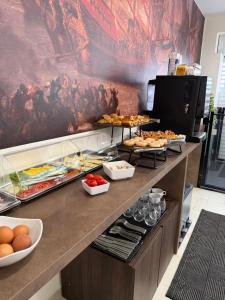 a buffet line with many different types of food at Lepanto Guesthouse in Misraħ Il-Barrieri