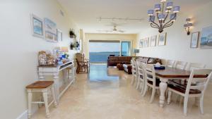 a living room with a table and chairs and a couch at 333 Mariners Club in Key Largo