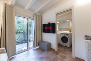 a laundry room with a washer and dryer at Sibilla house 2 in Olbia