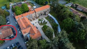 an overhead view of a building with a parking lot at Villa de Meslay in Montaigu-Vendée