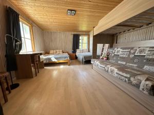 a large living room with a couch and a table at Metsatoa in Alliklepa