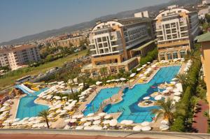 an aerial view of a resort with a pool and umbrellas at Hedef Resort Hotel - Ultra All Inclusive in Konaklı