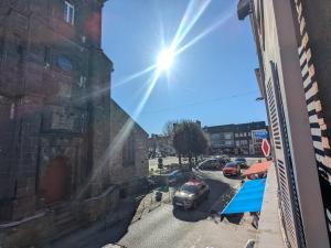 a view from a window of a parking lot at Appartement cosy - au cœur du bourg in Crozon +6 photos