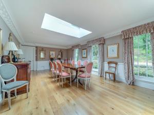 a dining room with a table and chairs at Kilmichael House in Brodick +40 photos
