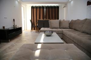 a living room with a couch and a table at Sarajevo Luxury Apartments in Sarajevo