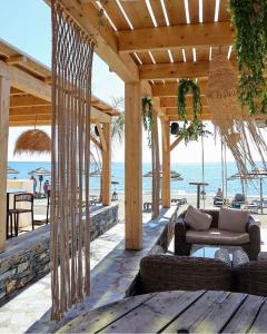an outdoor patio with a view of the ocean at Residence Marea Resort in Santa-Lucia-di-Moriani