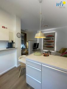 a kitchen with a counter top in a room at Stine's Hus Ferienwohnung 1 in Borkum