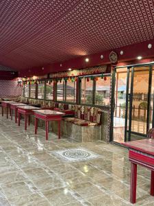 a row of tables and chairs in a restaurant at Rayyan Bedouin life camp in Wadi Rum