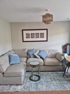 a living room with a couch and a table at The Ledger Rooms in Gort
