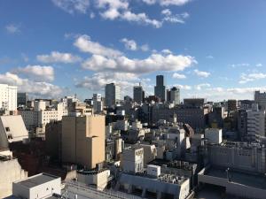 an aerial view of a city with tall buildings at Hotel Premium Green Sovereign in Sendai