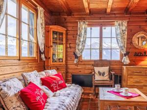 a living room with a couch and a table at Chalet Chalet Le Trèfle by Interhome in Salins +16 photos