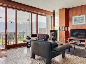 a living room with two couches and a television at Villa Villa Bikini by Interhome in Saint-Gingolph