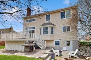 a large house with a deck and a patio at York Starfish Haven in York