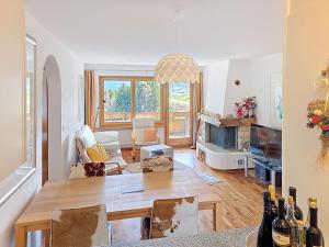 a living room with a table and a dining room at Apartment Toissa A6 by Interhome in Salouf +36 photos
