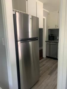 a stainless steel refrigerator in a kitchen at Cozy Columbia Retreat in Columbia +4 photos