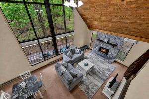 an overhead view of a living room with a fireplace at DogFriendly wHot Tub Fire Pit Resort Access in Hedgesville