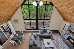 an overhead view of a living room with large windows at DogFriendly wHot Tub Fire Pit Resort Access in Hedgesville