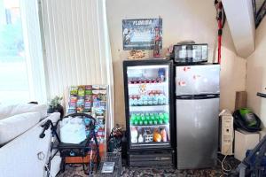 a small refrigerator in a room with at Campus Inn by Hotel O Gainesville - University Area in Gainesville