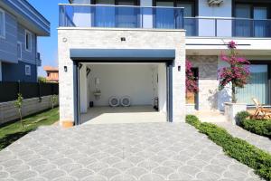a garage with two large tires inside of it at Villa Kalinda Your Private Sheltered Luxury Villa with Pool Minutes Away from Dalaman Airport in Dalaman