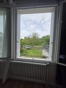 a window in a room with a view of a field at Doré in Carhaix-Plouguer