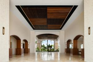 a view of the lobby of a building with a wooden ceiling at Blue Haven Resort- All Inclusive in Providenciales +192 photos